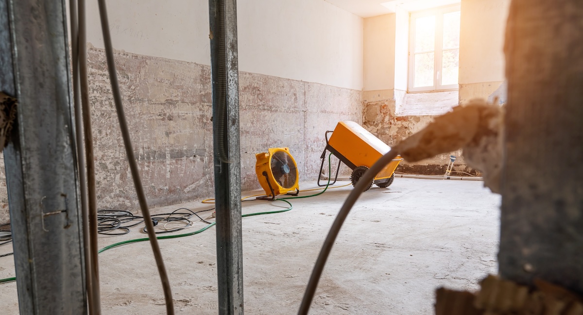 Water damaged apartment, prepared and ready for renovate after flood damage with drying fans